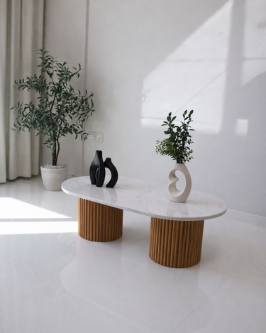 Oval white marble coffee table with cylindrical wooden legs