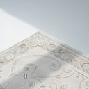 Elia Rug minimalist white rug with classic pattern detail