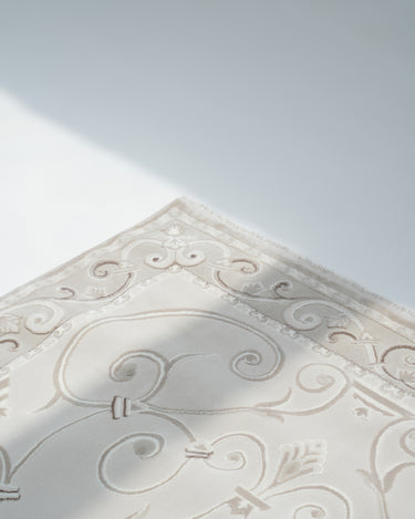 Elia Rug minimalist white rug with classic pattern detail