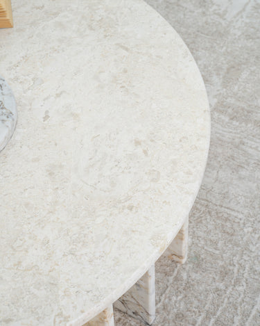 Beige marble coffee table with architectural base design