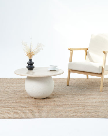 Aurela Beige stone coffee table with textured rounded base