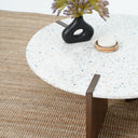 White terrazzo coffee table with walnut brown wood support