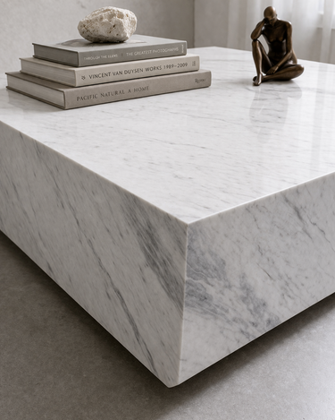 Close-up of Althea marble coffee table corner showing premium White Volakas marble with natural grey veining and seamless edges