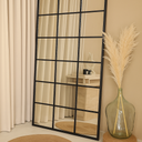 Vian black grid floor mirror with rectangular window pane design in modern interior