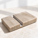 Serpeggiante Marble phone holder with a recessed phone slot, angled view