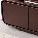 Modern brown entertainment console with a plant on top in a minimalistic room.