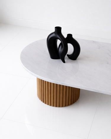 Sculptural oval coffee table with fluted wood pedestal bases