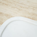 white marble serving tray on stone surface