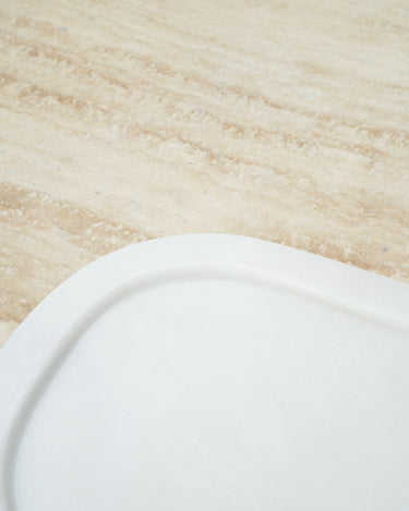 white marble serving tray on stone surface
