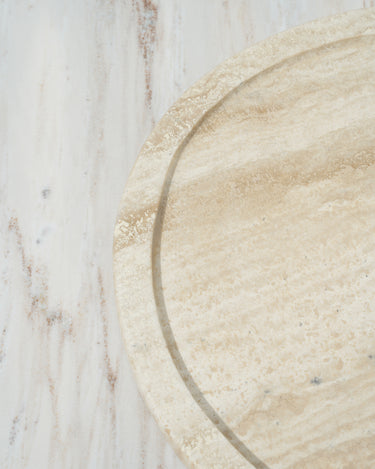 round stone platter with natural porous texture