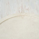 round marble platter placed on stone background