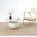 Aurela Beige stone coffee table with textured rounded base