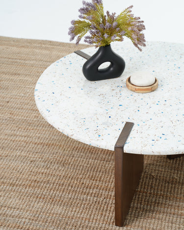 White terrazzo coffee table with walnut brown wood support