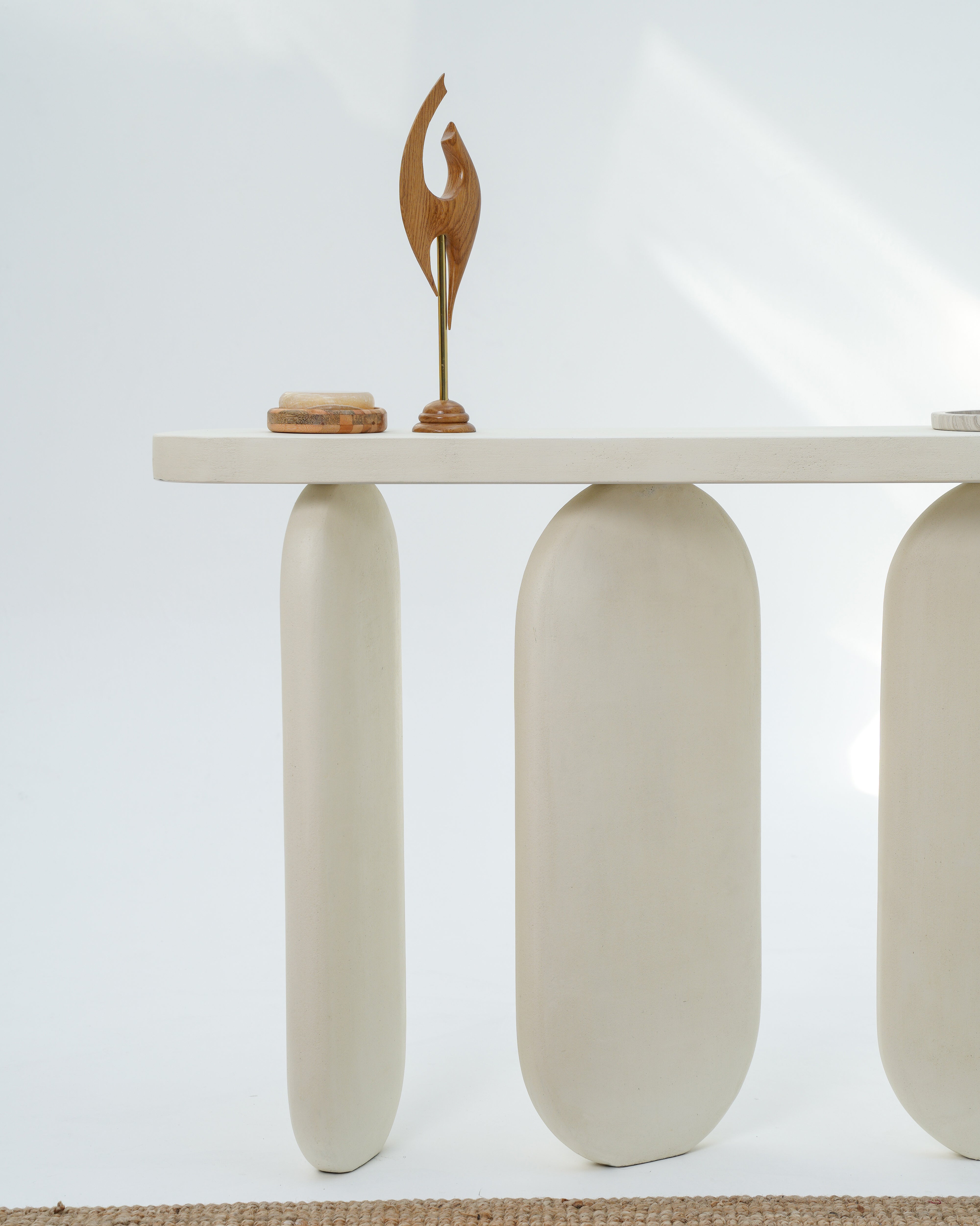 Jovia Console Table side view showing three pillar base