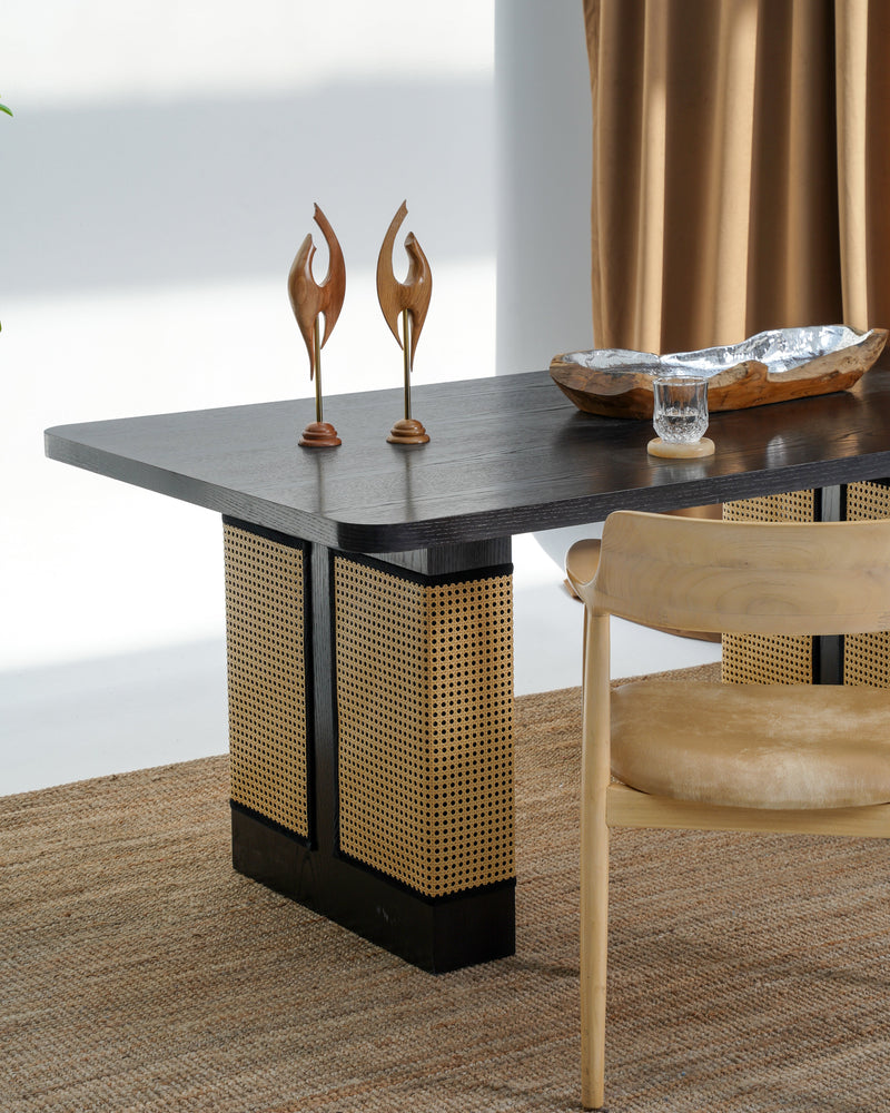 Carin Black Oak Dining Table with Natural Rattan Legs