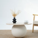 Aurela travertine coffee table with sculptural micro cement base