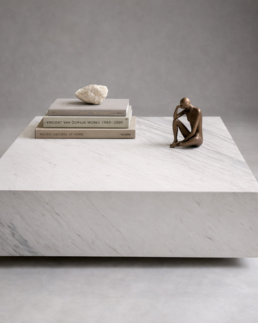 Large square marble coffee table with polished white stone finish
