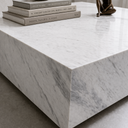 Close-up of Althea marble coffee table corner showing premium White Volakas marble with natural grey veining and seamless edges