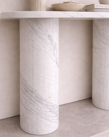 Close-up of Evelyn marble console table leg showing solid cylindrical base in premium White Volakas marble with natural grey veining