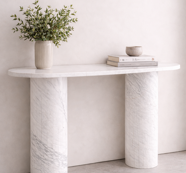Evelyn console table in White Volakas marble, 120 cm modern minimalist console with oval top and cylindrical marble legs in neutral interior