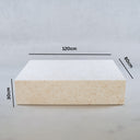 Low-profile marble coffee table in warm beige tones