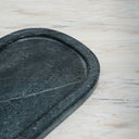 Lumi spider green marble serving tray on stone surface