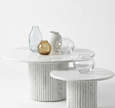 Margot nesting coffee table set in White Volakas marble, large and small round tables with fluted base, minimalist contemporary living room furniture