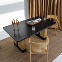 Carin Black Oak Dining Table with Natural Rattan Legs