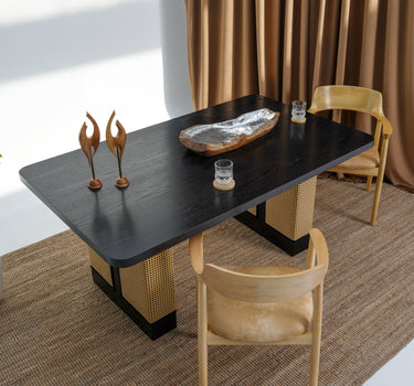 Carin Black Oak Dining Table with Natural Rattan Legs