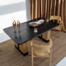 Carin Black Oak Dining Table with Natural Rattan Legs