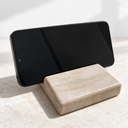 Serpeggiante Marble phone holder supporting a phone in landscape orientation